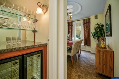 Exquisite home features vaulted ceilings & arched windows