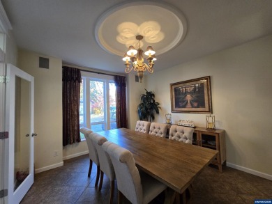 Exquisite home features vaulted ceilings & arched windows