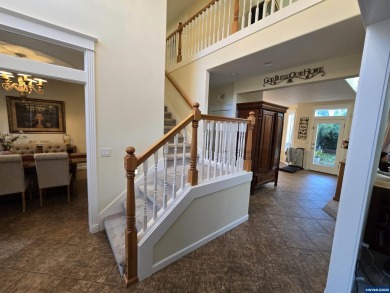 Exquisite home features vaulted ceilings & arched windows