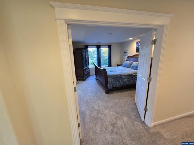 Exquisite home features vaulted ceilings & arched windows