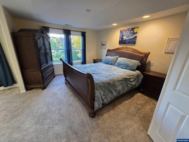 Exquisite home features vaulted ceilings & arched windows