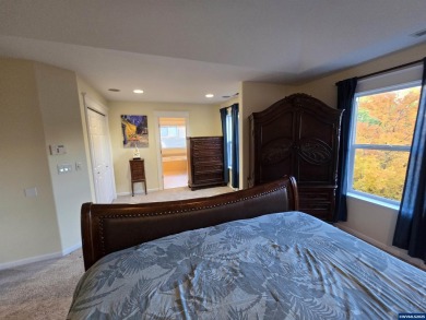 Exquisite home features vaulted ceilings & arched windows