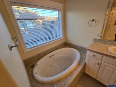 Exquisite home features vaulted ceilings & arched windows