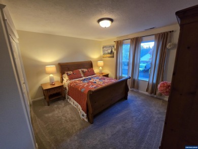 Exquisite home features vaulted ceilings & arched windows