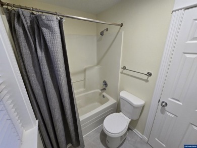 Exquisite home features vaulted ceilings & arched windows