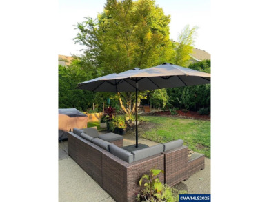 Exquisite home features vaulted ceilings & arched windows