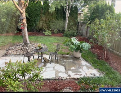 Exquisite home features vaulted ceilings & arched windows