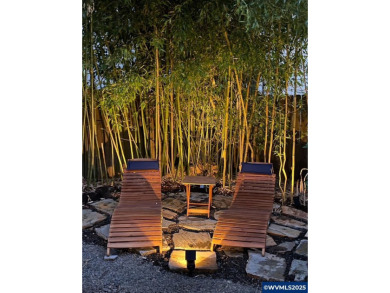 Exquisite home features vaulted ceilings & arched windows