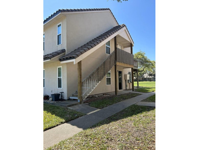 Highly sought after ground floor corner end unit overlooking the - photo 1