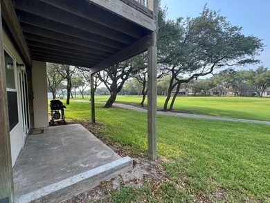Highly sought after ground floor corner end unit overlooking the - photo 2