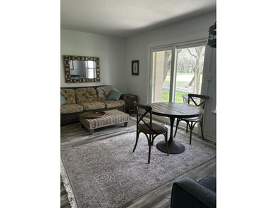 Highly sought after ground floor corner end unit overlooking the - photo 4