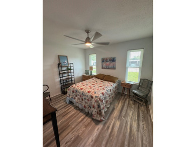 Highly sought after ground floor corner end unit overlooking the - photo 5