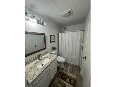 Highly sought after ground floor corner end unit overlooking the - photo 7