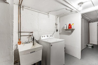 Updated one-family attached brick townhouse nestled in the heart - photo 13