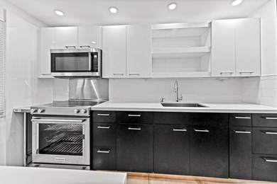 Stylishly updated 2-bedroom, 1.5-bathroom corner unit in the - photo 5