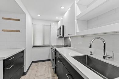 Stylishly updated 2-bedroom, 1.5-bathroom corner unit in the - photo 6