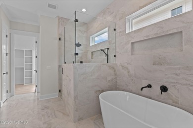 Welcome to luxury living in the coveted Marsh Landing Place!