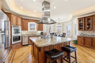 Set on the private waters of Treeline Lake in Four Seasons, this - photo 12