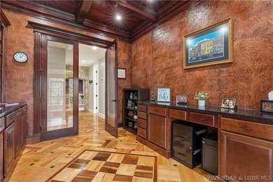 Set on the private waters of Treeline Lake in Four Seasons, this - photo 16