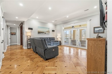 Set on the private waters of Treeline Lake in Four Seasons, this - photo 28