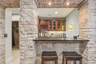 Set on the private waters of Treeline Lake in Four Seasons, this - photo 32