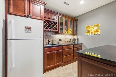 Set on the private waters of Treeline Lake in Four Seasons, this - photo 35