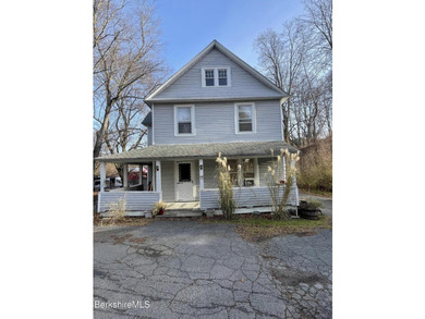 Welcome to 41 Pearl Street- a 1900s two-family residence nestled