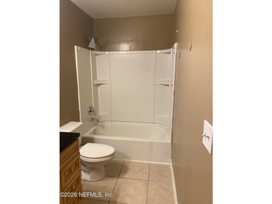 One bedroom, one bathroom condo on first floor. Tile flooring - photo 4
