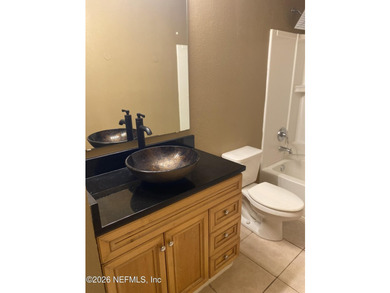 One bedroom, one bathroom condo on first floor. Tile flooring - photo 5