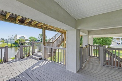 Tucked inside the highly sought-after Pass Christian Isles, this - photo 2