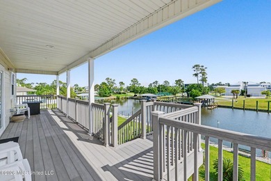 Tucked inside the highly sought-after Pass Christian Isles, this - photo 3
