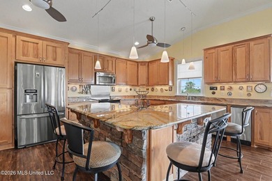 Tucked inside the highly sought-after Pass Christian Isles, this - photo 9