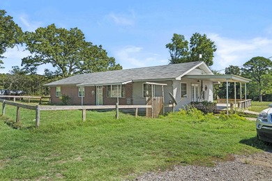 This home sits on approximately 16.25 partially fenced acres