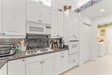 Nestled within the prestigious Woodfield Country Club, this - photo 16