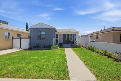 Nestled on a quiet tree lined street in North Long Beach, this - photo 1