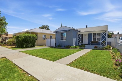Nestled on a quiet tree lined street in North Long Beach, this - photo 2