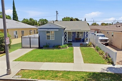 Nestled on a quiet tree lined street in North Long Beach, this - photo 4