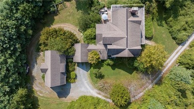 Tucked away on nearly three private acres just moments from the - photo 46