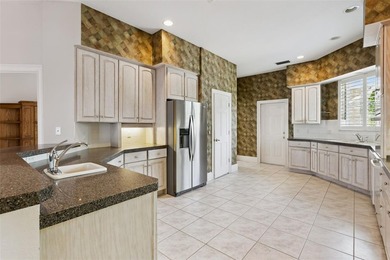 Experience exceptional lakefront living in this custom-built - photo 15