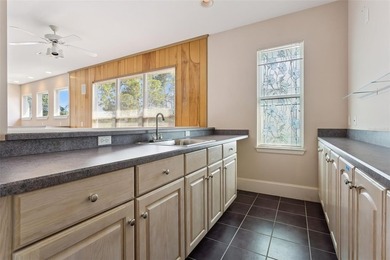 Experience exceptional lakefront living in this custom-built - photo 19