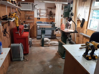 Nestled along the peaceful shoreline of a sheltered cove with - photo 38