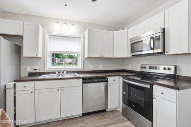 Welcome to 154 Polk Rd - a charming concrete block home situated - photo 10