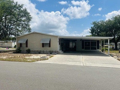 This well-furnished double wide home is perfectly situated on a - photo 1