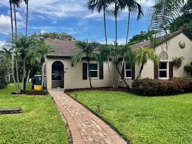 Welcome to this charming two-bedroom, two-bathroom villa in the - photo 1