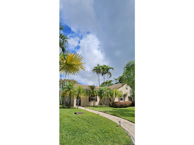 Welcome to this charming two-bedroom, two-bathroom villa in the - photo 3