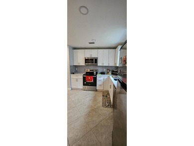 Welcome to this charming two-bedroom, two-bathroom villa in the - photo 8