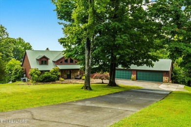 Stunning log home on the main channel of Douglas Lake! This - photo 2
