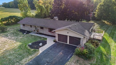 OPPORTUNITY IS KNOCKING with this ALL BRICK 1,800 square foot - Lake Home Off Market in Comstock Park, Michigan