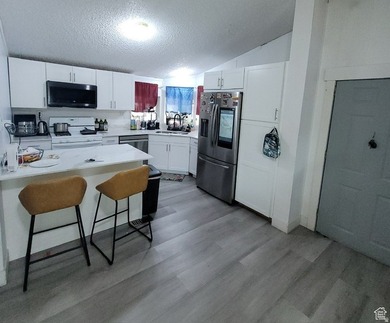 Spacious double wide is ready for your family! Located in one of - photo 2
