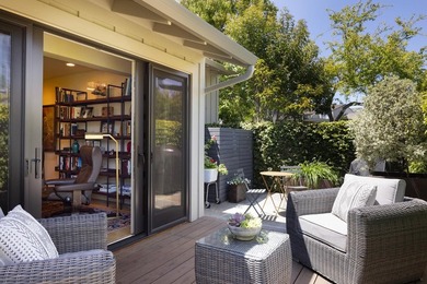 This exquisitely updated townhome enjoys privacy, sunshine, and - photo 13